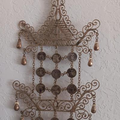 ORNATE METAL WALL ART FROM THE PHILIPPINES AND WOODEN STACKING STOOLS WITH WOVEN TOPS