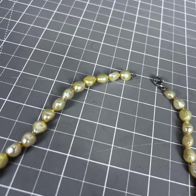 String of Pearls (light yellow tone) with Sterling Clasp. PRETTY! 