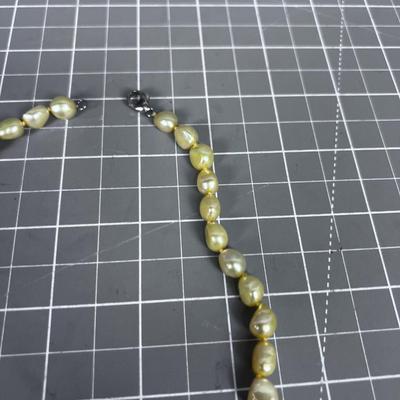 String of Pearls (light yellow tone) with Sterling Clasp. PRETTY! 