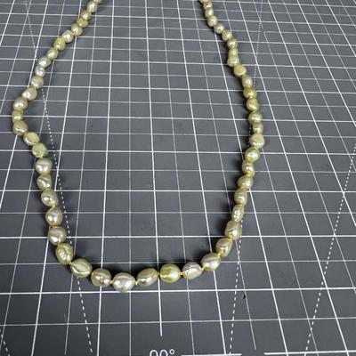 String of Pearls (light yellow tone) with Sterling Clasp. PRETTY! 