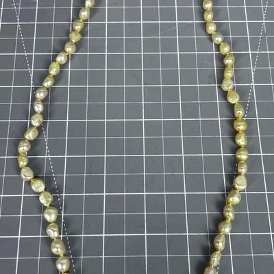String of Pearls (light yellow tone) with Sterling Clasp. PRETTY! 
