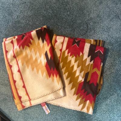 wooden bar barrel stool and two thrown blankets