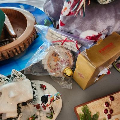 Christmas lot with thrown blankets and Bin