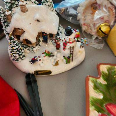 Christmas lot with thrown blankets and Bin