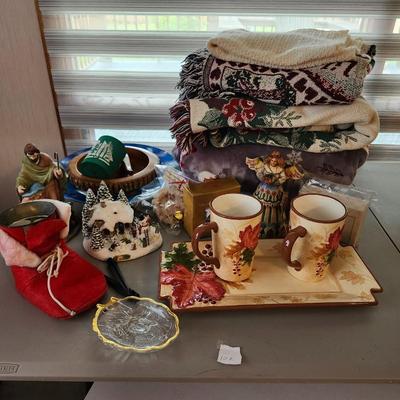 Christmas lot with thrown blankets and Bin