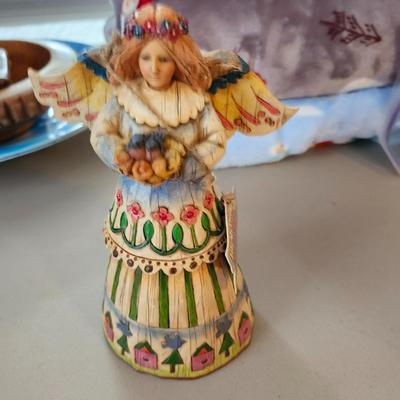 Christmas lot with thrown blankets and Bin