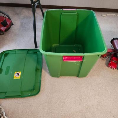 Christmas lot with thrown blankets and Bin