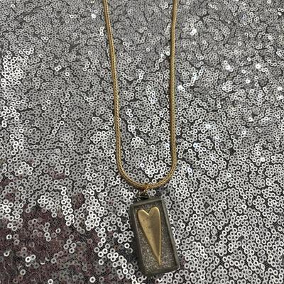 Gold toned mesh necklace with Jewel Kade heart charm two sided