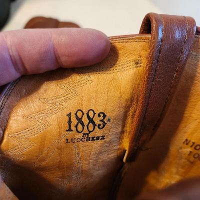 Three Pair of cowboy boots and Boot brush