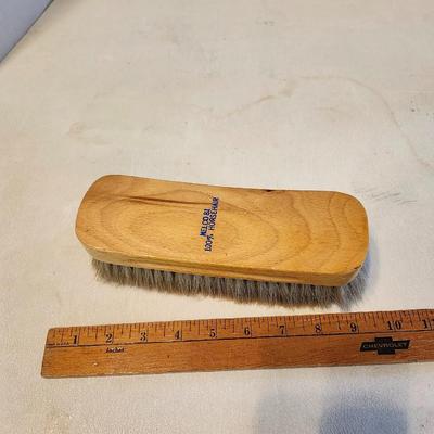 Three Pair of cowboy boots and Boot brush