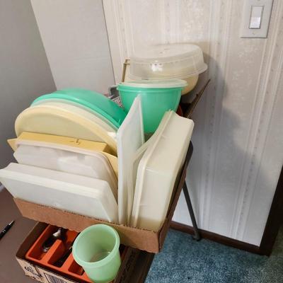 Kitchen plastic food containers including some Tupperware, silverware and other accessories