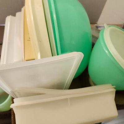 Kitchen plastic food containers including some Tupperware, silverware and other accessories