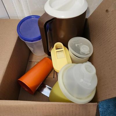 Kitchen plastic food containers including some Tupperware, silverware and other accessories
