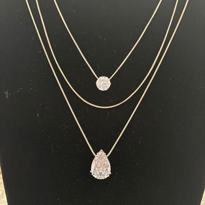 Layered Silver toned mesh chain with pear and round shaped crystal glass type pendant