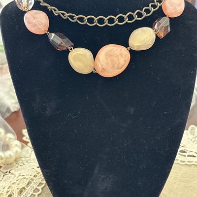 Gold tone choker and rocks and pearl like necklace