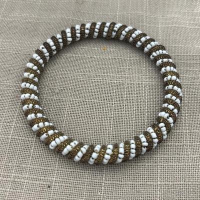 African beaded white and gold tone bracelet