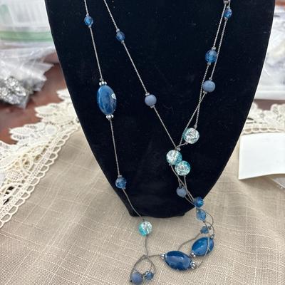 Extra long blue beaded necklace