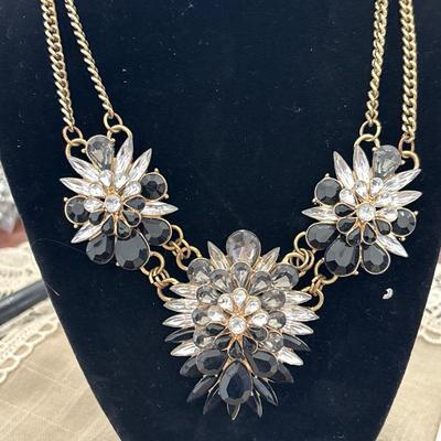 Gold toned flower gem statement necklace