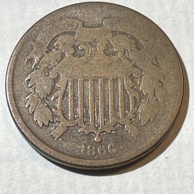 1866 GOOD CONDITION TWO CENT PIECE TYPE COIN AS PICTURED.