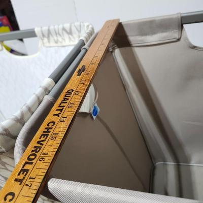 Two Cloth laundry baskets and seat cushions