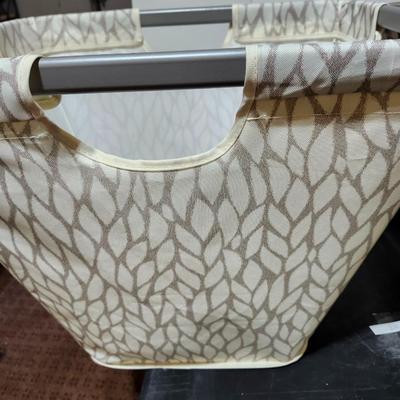 Two Cloth laundry baskets and seat cushions