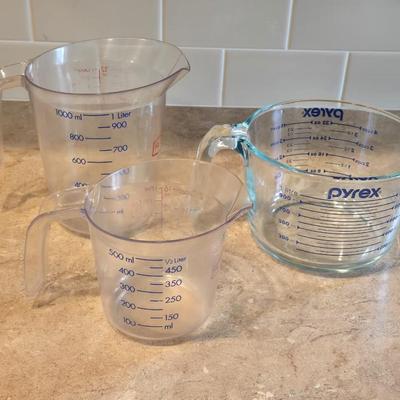 Glass Pyrex Measuring Cup and 2 Plastic Measuring Cups