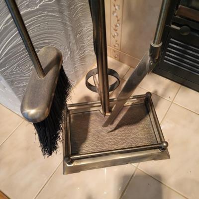 FIREPLACE TOOLS IN A HOLDER AND A CAST IRON WOOD STOVE REPLICA
