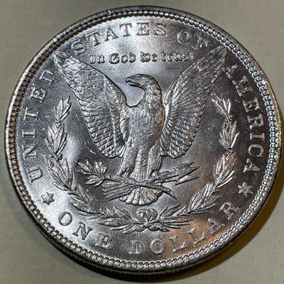 1890 BU CONDITION MORGAN SILVER DOLLAR AS PICTURED.