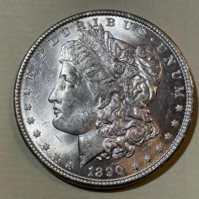 1890 BU CONDITION MORGAN SILVER DOLLAR AS PICTURED.