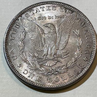 1896-P TONED UNCIRCULATED CONDITION MORGAN SILVER DOLLAR AS PICTURED.