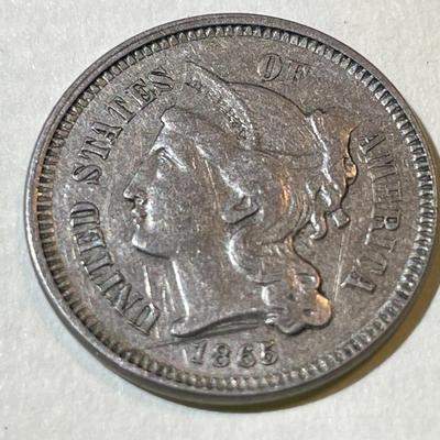 1865 EF/AU CONDITION/SEVERELY SCRATCHED THREE CENT NICKEL TYPE COIN AS PICTURED.
