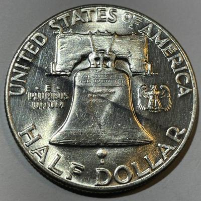 1954-P UNCIRCULATED CONDITION FRANKLIN SILVER HALF DOLLAR AS PICTURED.