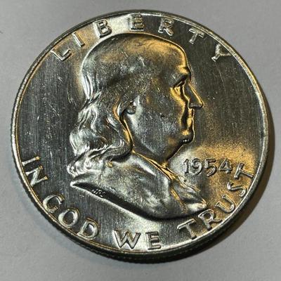 1954-P UNCIRCULATED CONDITION FRANKLIN SILVER HALF DOLLAR AS PICTURED.