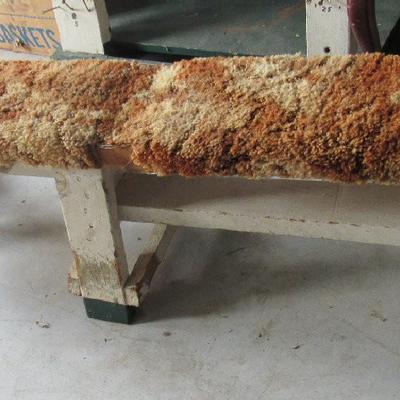 Very Long Sturdy Wood Bench With Carpeting Covering It