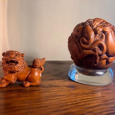 Chinese carved sphere and foo dog