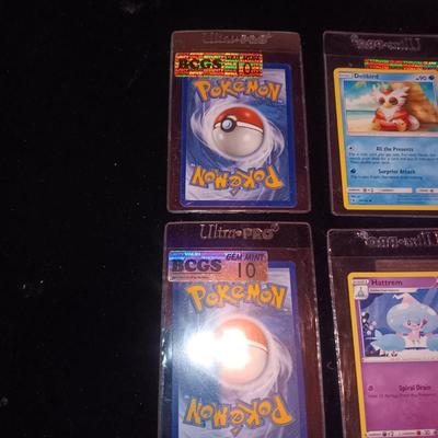 MINT POKEMON CARDS AND A STACK OF BONE CARDS