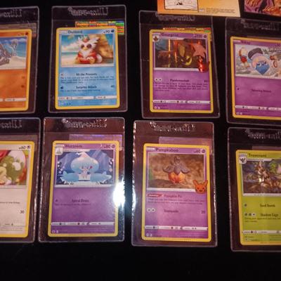 MINT POKEMON CARDS AND A STACK OF BONE CARDS