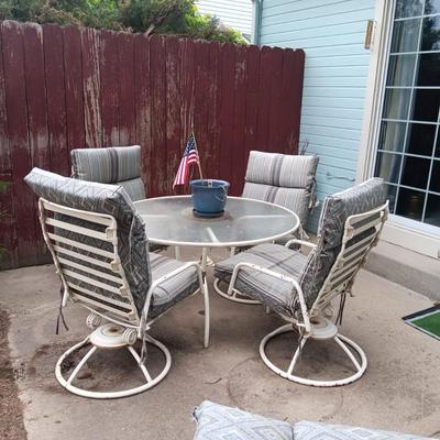 GLASS TOP PATIO TABLE W/4 HEAVY METAL ROCKING CHAIRS PLUS METAL LOUNGE CHAIR