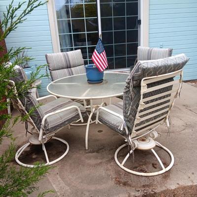 GLASS TOP PATIO TABLE W/4 HEAVY METAL ROCKING CHAIRS PLUS METAL LOUNGE CHAIR