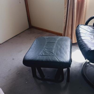 BLACK RECLINING, ROCKING AND SWIVEL CHAIR W/OTTOMAN