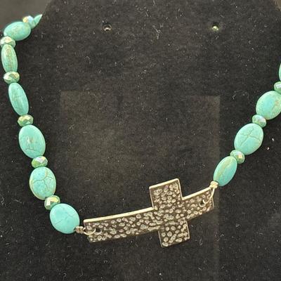 Turquoise tone howlite choker necklace with silver tone cross