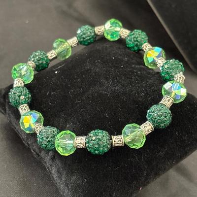 Silver tone and green beaded stretchy bracelet