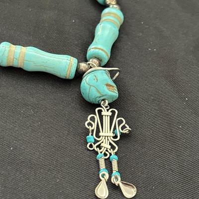 Turquoise tone skittle beaded necklace with skull pendant