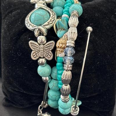 Turquoise tone beaded and charm bracelets