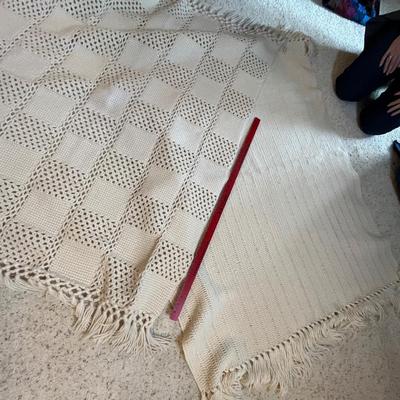 Two white lap robes