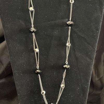 Silver tone long black and silver beaded necklace