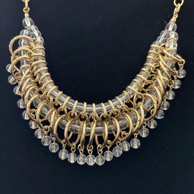 Gold toned dangling bib necklace