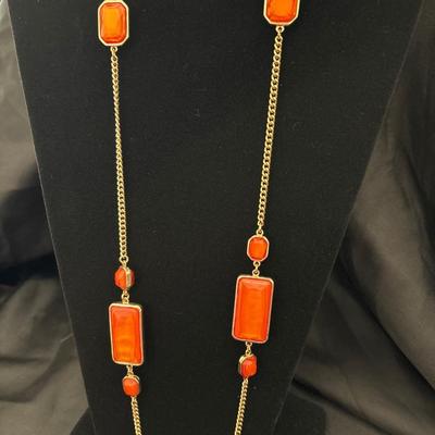 Gold, toned, beautiful fashion necklace with orange like stones