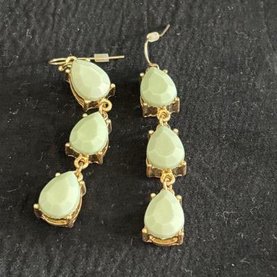 Gold tone green crystal dangle earrings