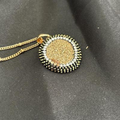 Gold tone rhinestone pendant necklace